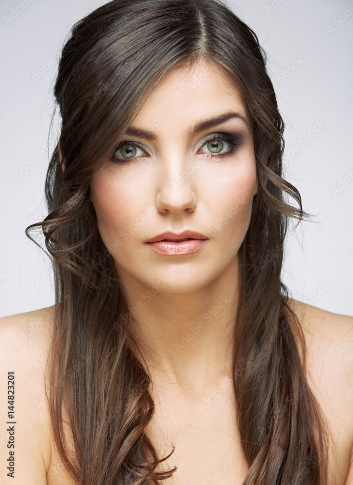 Fototapeta premium Young beauty woman face close up portrait. Female model with long hair.