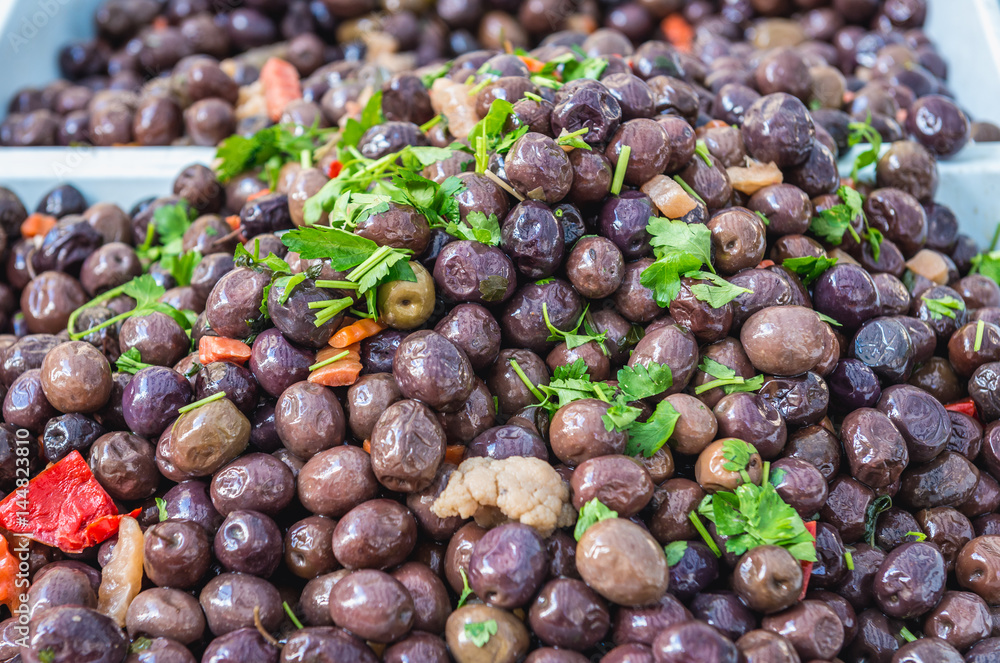 Fototapeta premium Stall with olives on market place of Ortygia isle, Syracuse city, Sicily Island in Italy