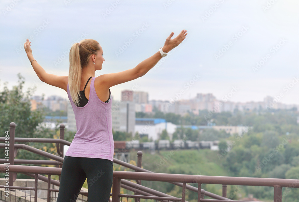 Joyful woman breathing fresh air outdoors Joyful woman breathing fresh air outdoors