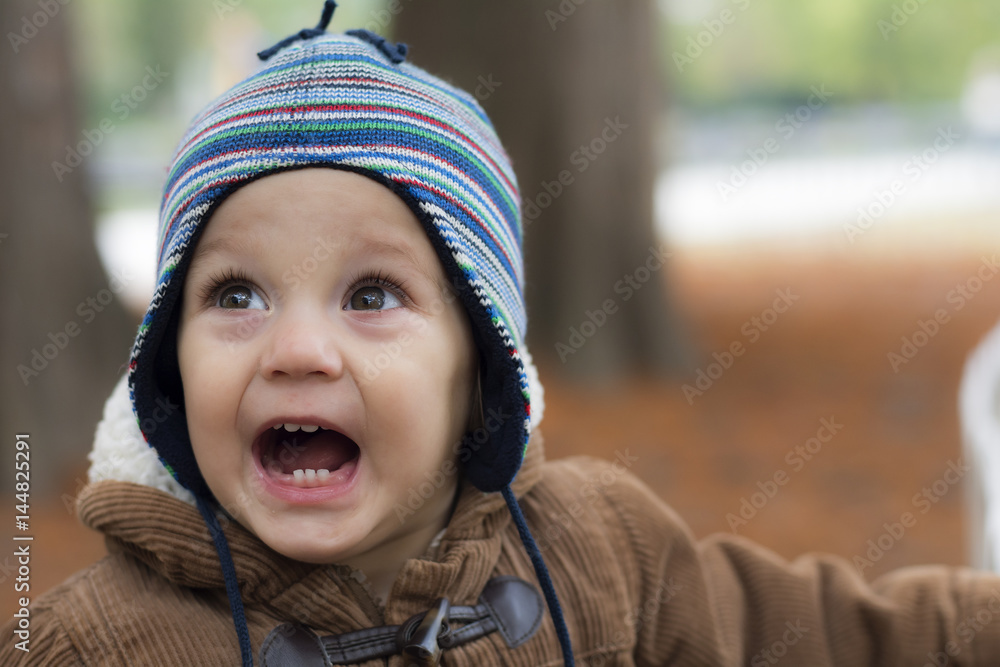 Little boy standing in autumn park Little boy standing in autumn park