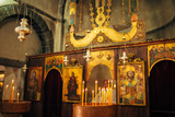 The interior of the church. Icons, chandelier, candles in a small Christian Orthodox church in Montenegro.