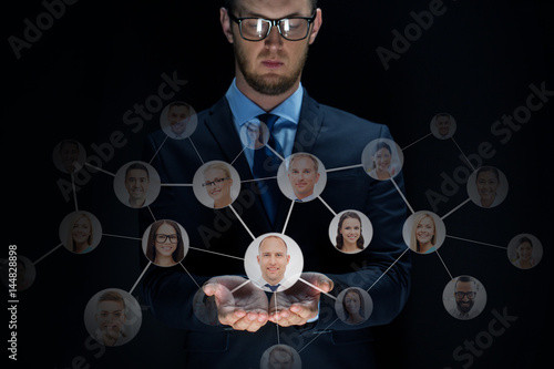 businessman with network contacts over black