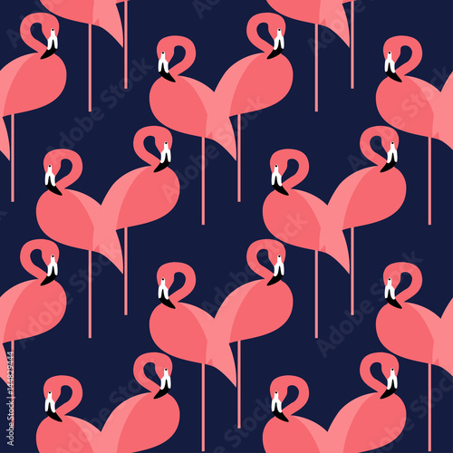 Seamless vector background with pink flamingos on a dark blue background.