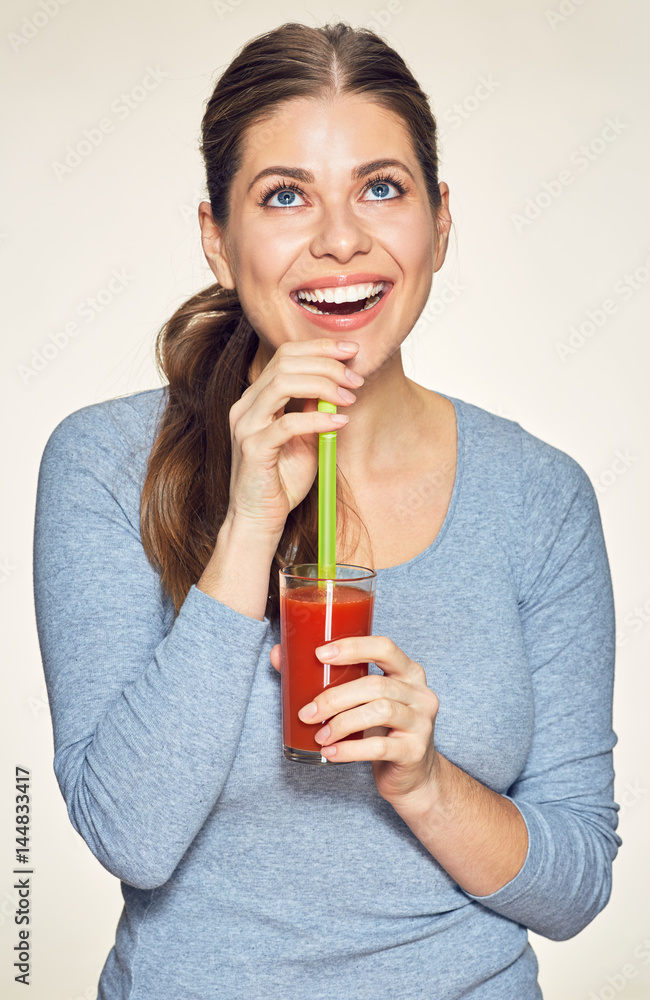 Smiling woman with long hair drink red juice Smiling woman with long hair drink red juice