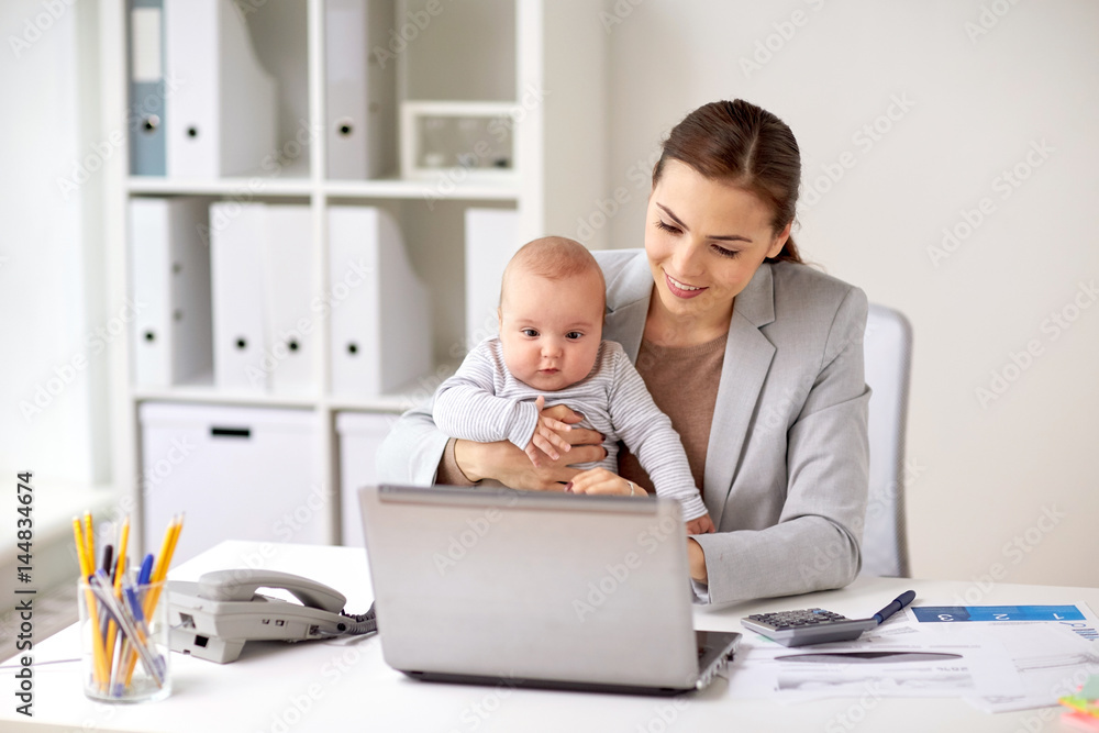 happy businesswoman with baby and laptop at office happy businesswoman with baby and laptop at office