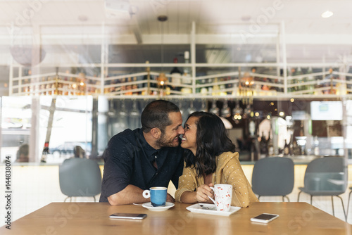 Smiling couple of lovers kissing.