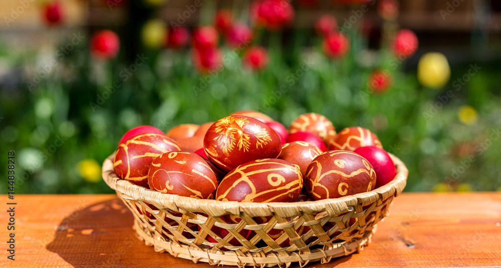 Colorful Easter eggs in a basket Colorful Easter eggs in a basket