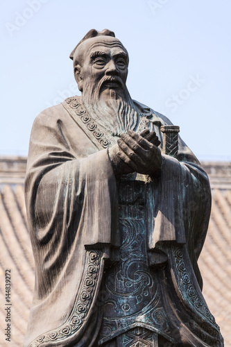 Bronze statue of Confucius in traditional pose
