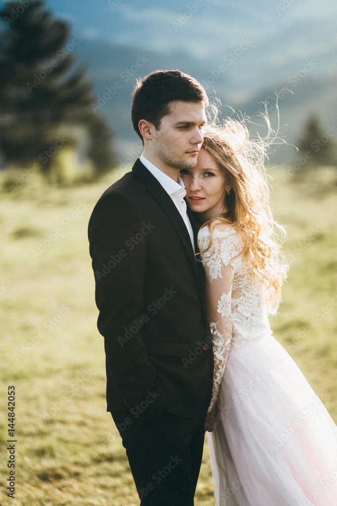 Beautiful bride and groom at the mountains Beautiful bride and groom at the mountains