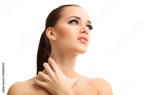 Young woman suffering from sore throat isolated over white background