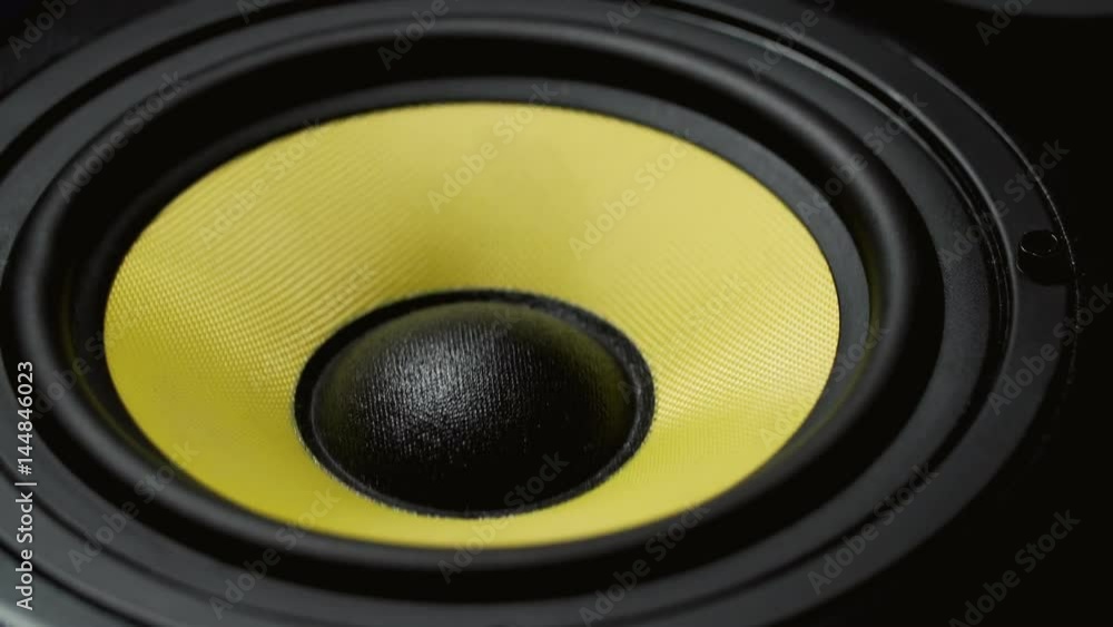 Close up at moving sub-woofer. Speaker part. Black and yellow colors. 4k video Close up at moving sub-woofer. Speaker part. Black and yellow colors. 4k video
