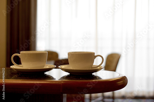 cup of coffee on wooden table