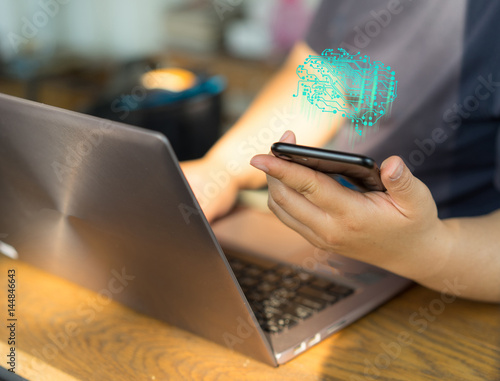 Woman hands work on labtop and smart phone. photo