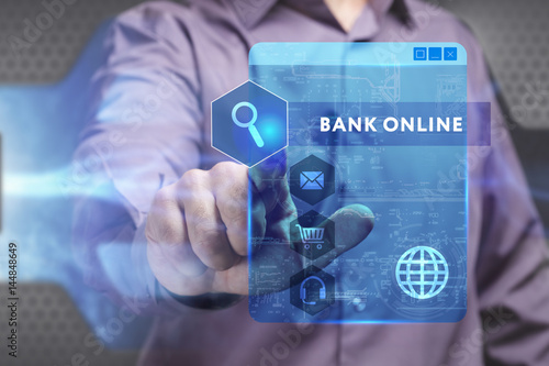 Business, Technology, Internet and network concept. Young businessman working on a virtual screen of the future and sees the inscription: Bank online