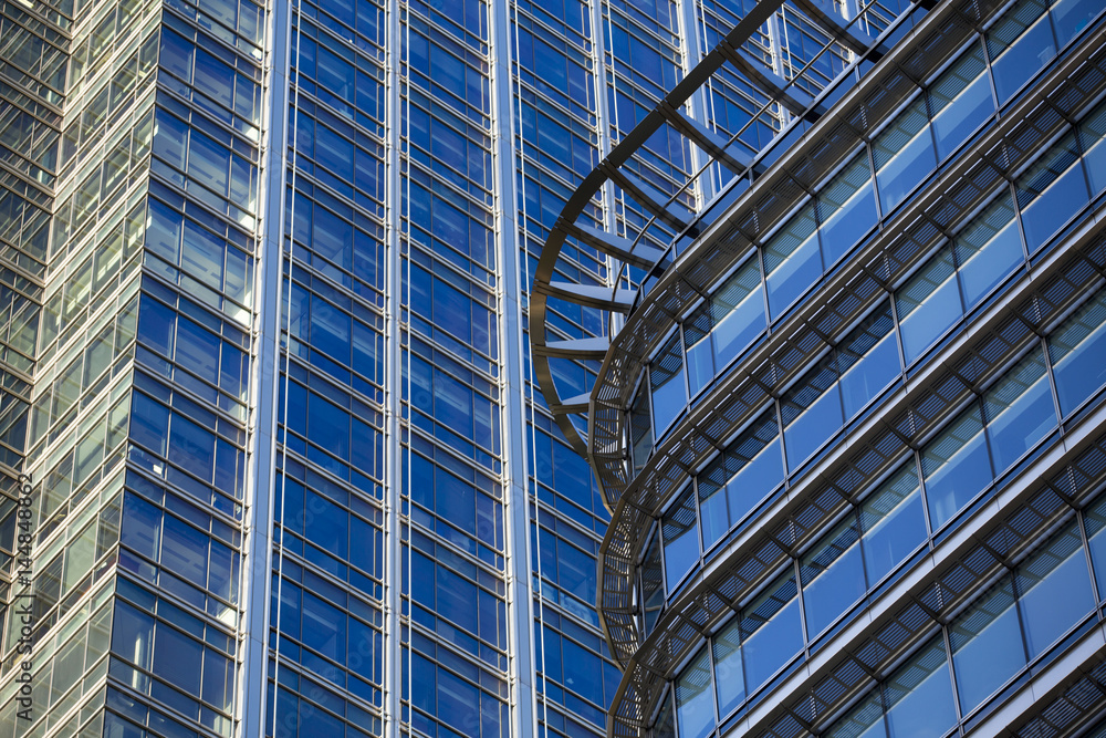 Perspective and underside angle view to textured background of modern glass building skyscrapers Perspective and underside angle view to textured background of modern glass building skyscrapers