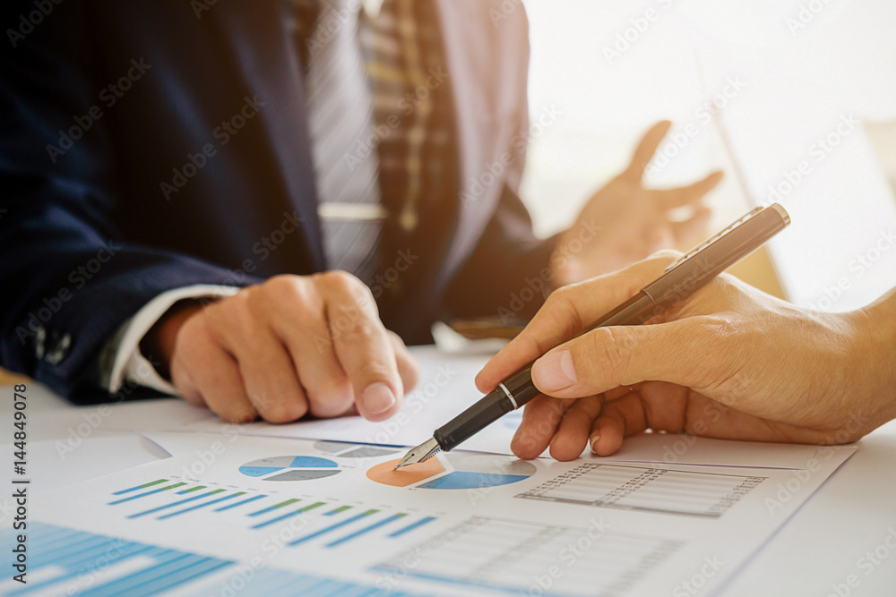Business concept. Business people discussing the charts and graphs showing the results of their successful teamwork. Selective focus.Accounting Business concept. Business people discussing the charts and graphs showing the results of their successful teamwork. Selective focus.Accounting