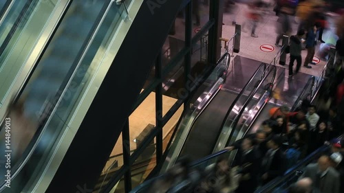 Time lapse of people moving on escalator at Incheon International Airport in South Korea photo