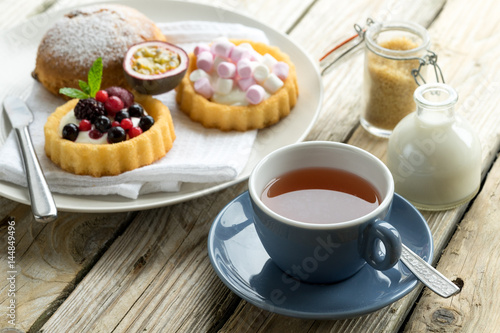 Obraz na płótnie old school style tea at five afternoon service set cake sweet traditional table hotel cheesecake sugar pot china cup w salonie