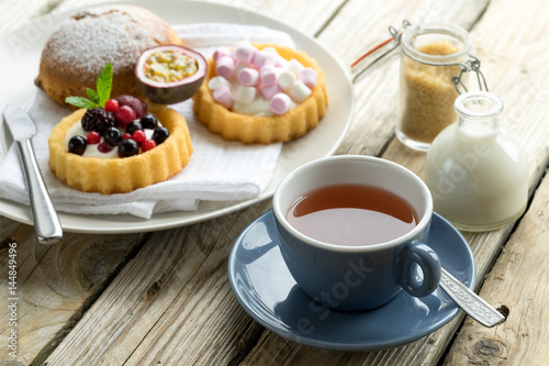 old school style tea at five afternoon service set cake sweet traditional table hotel cheesecake sugar pot china cup