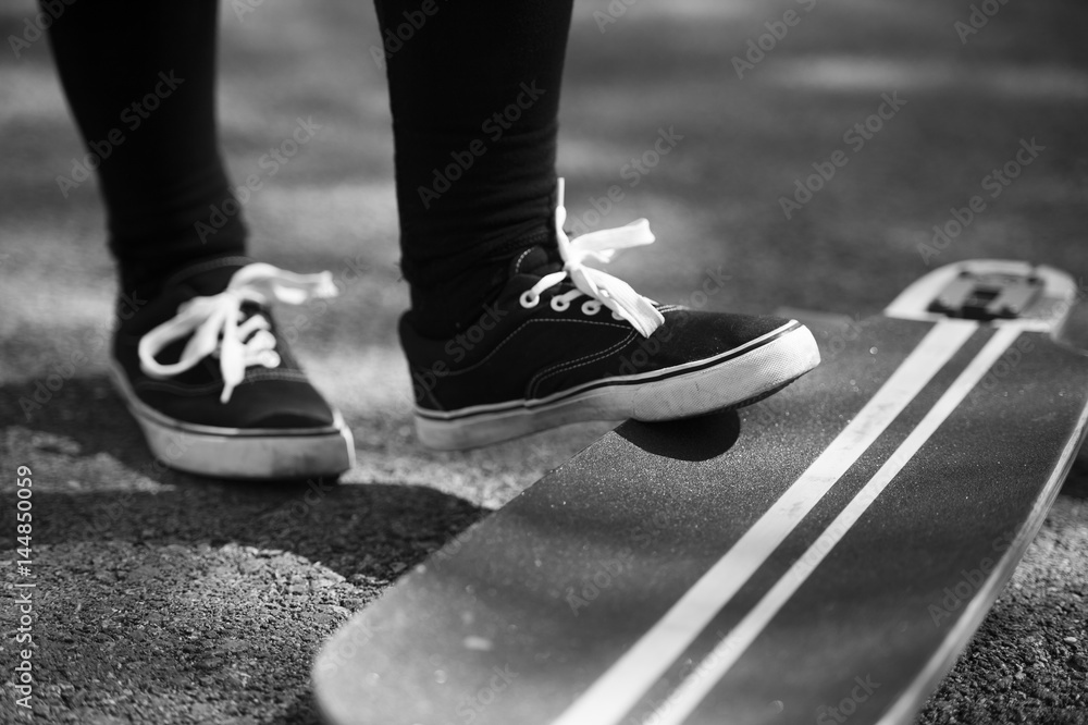 Longboard girl on the street at beautiful summer evening, long board Longboard girl on the street at beautiful summer evening, long board