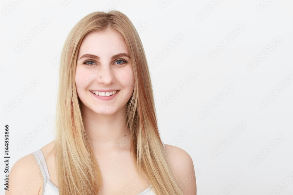 Closeup portrait of a beautiful young blond woman with clean face Closeup portrait of a beautiful young blond woman with clean face