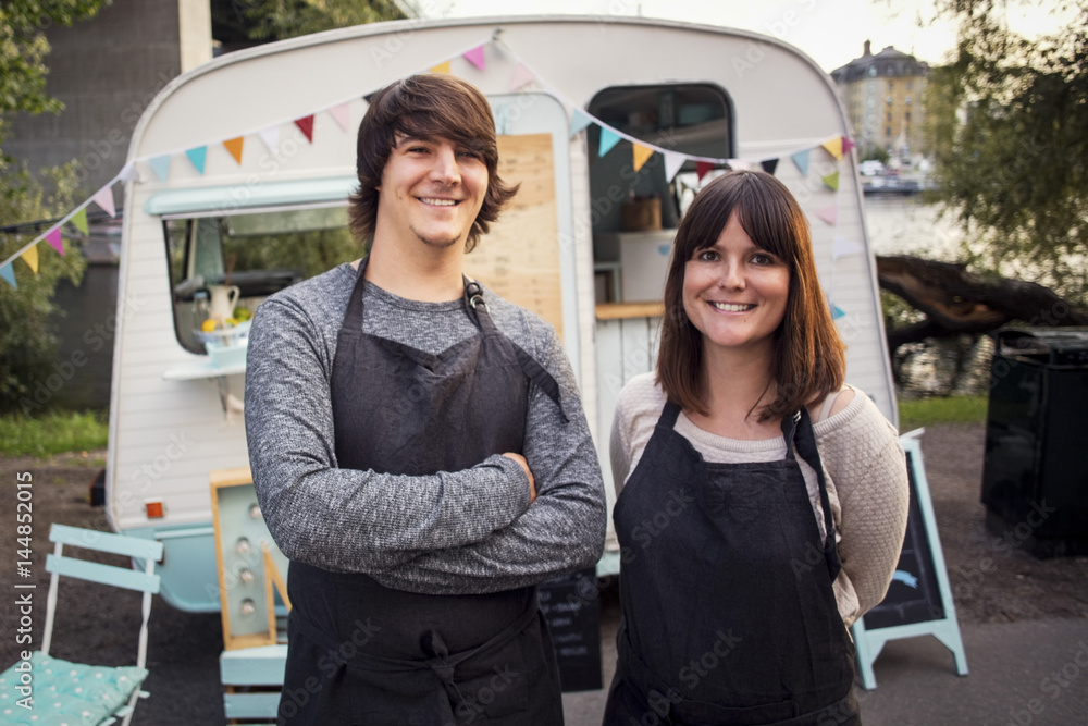 Portrait of two food truck workers Portrait of two food truck workers