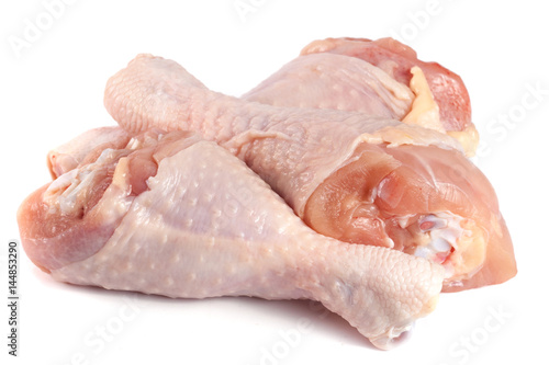 Three raw chicken drumsticks isolated on white background