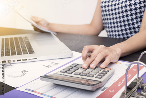 business accountant with document graph financial and calculator on office table. concept planning budget and audit.