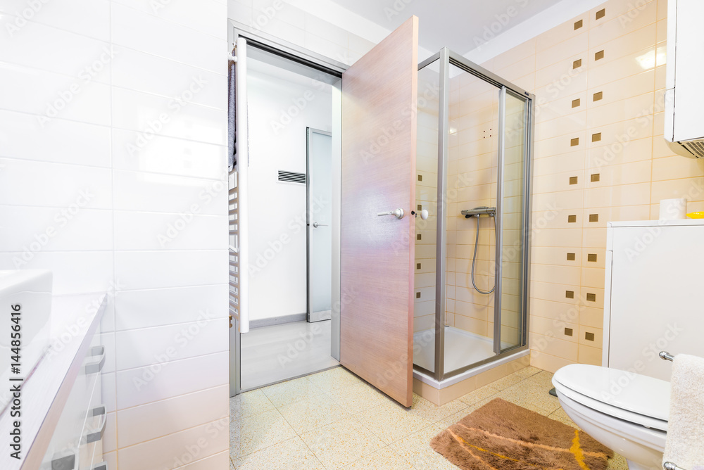 Modern small hotel bath with shower, sink and toilet. Modern small hotel bath with shower, sink and toilet.
