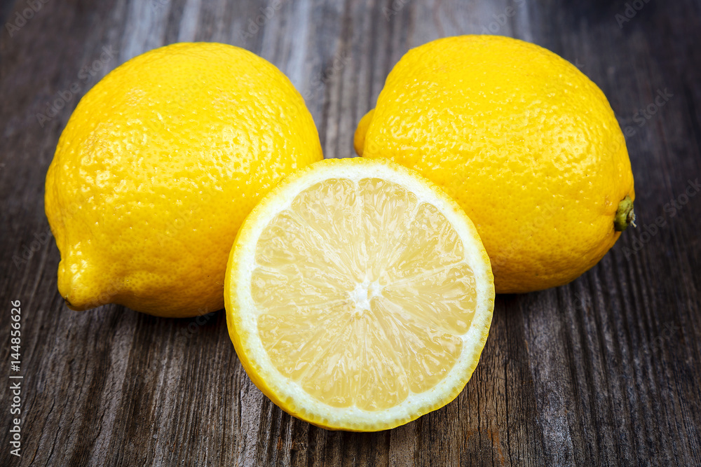 Fresh lemons on a wooden background Fresh lemons on a wooden background