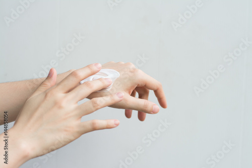 Close up woman hand apply lotion healthcare.