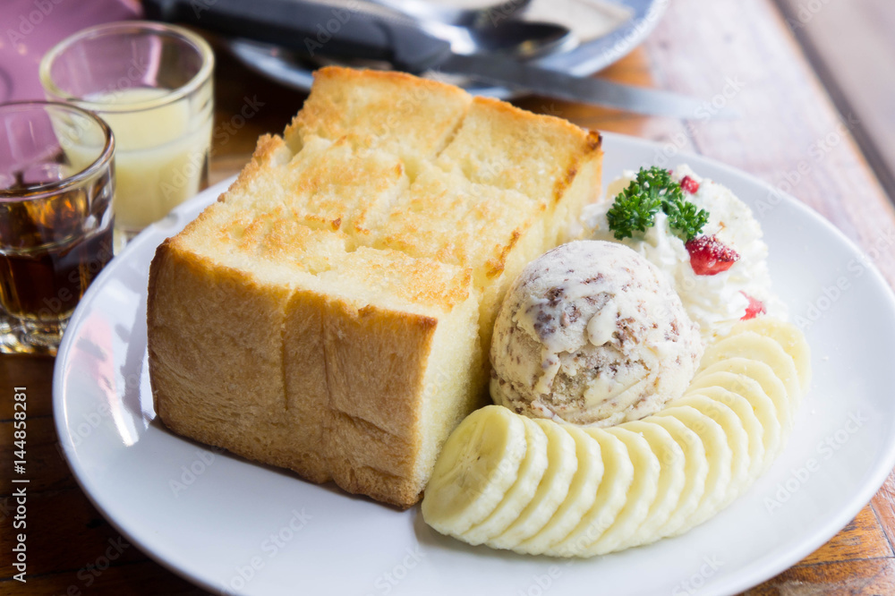 Toast and ice cream and banana dessert in cafe Toast and ice cream and banana dessert in cafe