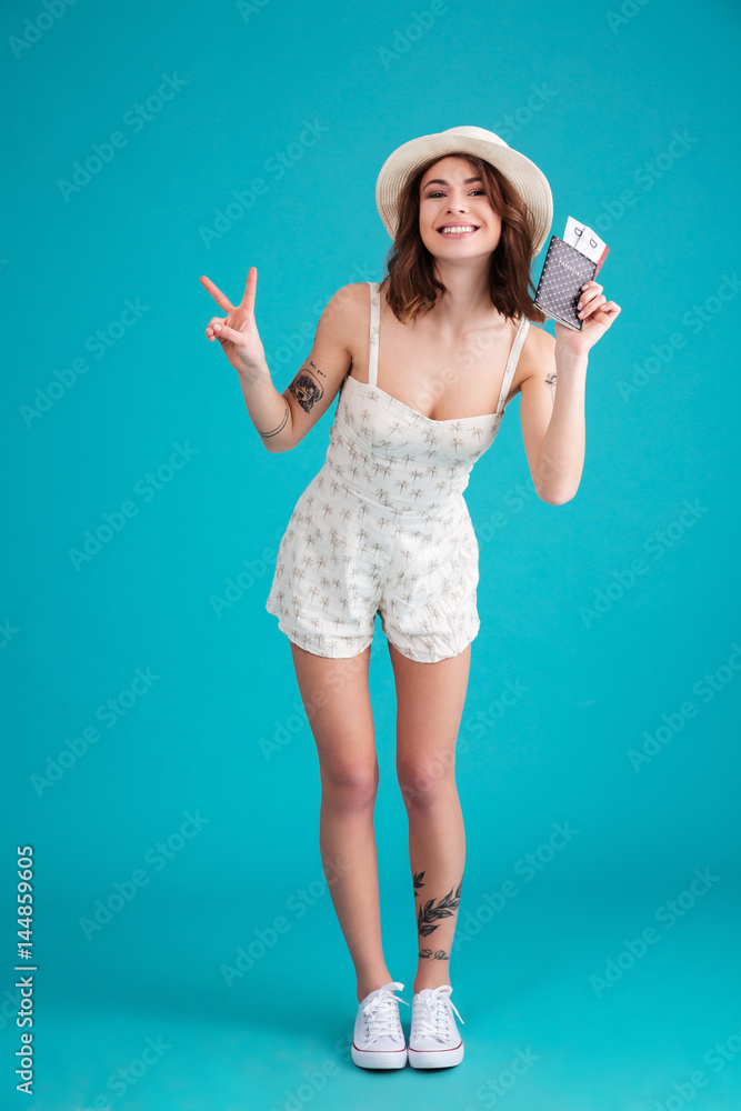 Full length portrait of a happy satisfied young traveller woman Full length portrait of a happy satisfied young traveller woman