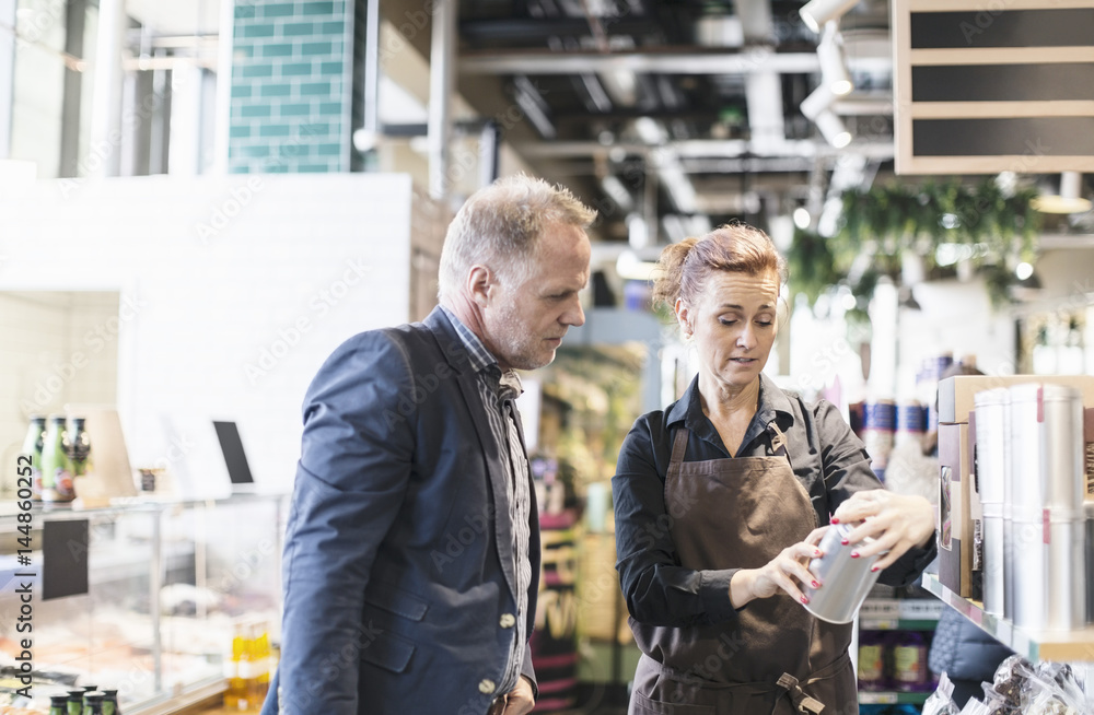 Customer talking with shop assistant