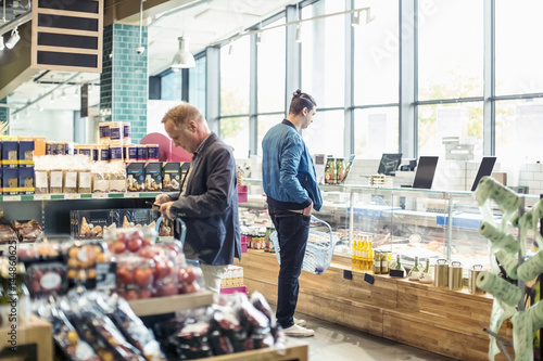 Men shopping in organic grocery store