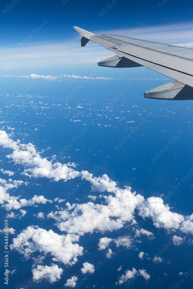 Obraz premium Above the clouds.Wing aircraft on the sky