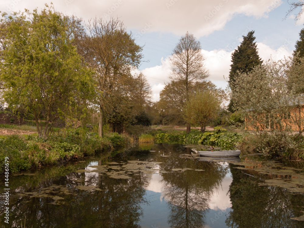 A Beautiful Garden With Trees and Plants and Lake in the Spring in the Uk