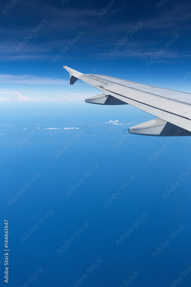 Fototapeta premium Above the clouds.Wing aircraft on the sky