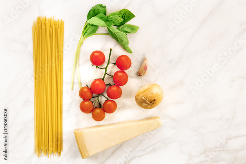 Basic pasta ingredients, including spaghetti and cheese