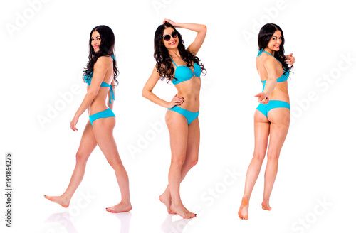 Full length portrait of young girls wearing blue bikini