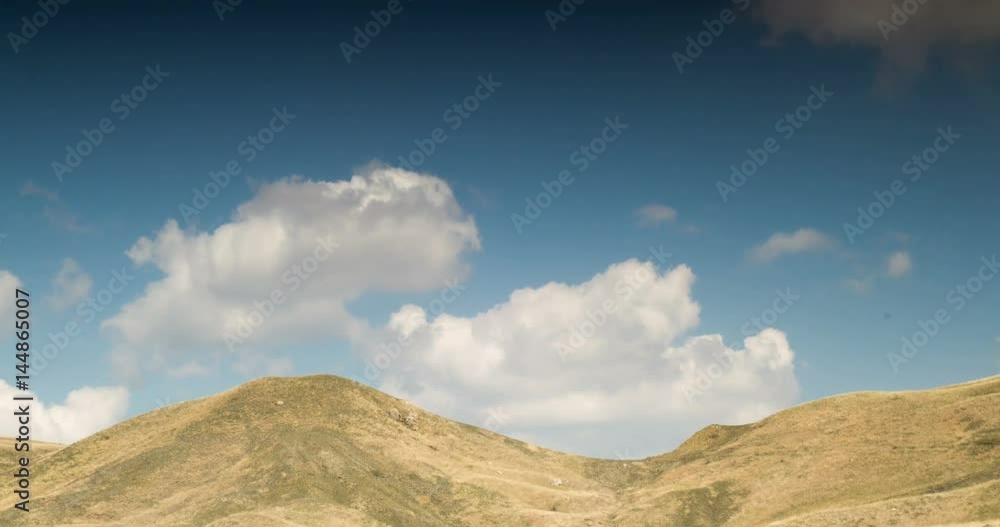 Cloudy sky above the yellow hills