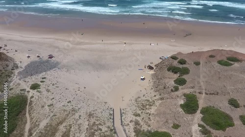 hidden surf beach in algarve portugal aerial drone waves ocean