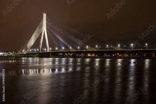 Riga (Latvia) - April 17, 2017: Vansu Bridge (Formerly Gorky Bridge) at night. Shroud Bridge. Vansu Bridge is one of the symbols of modern Riga. Crossing the Daugava River