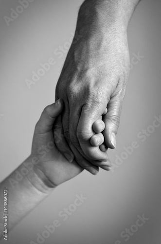 Adult Holding Hand of a Child Family Love