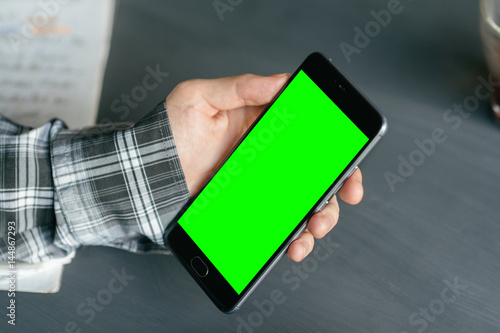 Business man using smart phone with green screen for internet and email. Sequence Concepts of using mobile technologies and smarfon in mobile applications in daily communication and photo