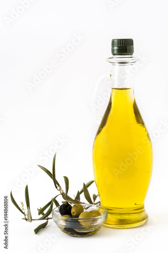 Virgin olive oil in a crystal bottle isolated on white background

