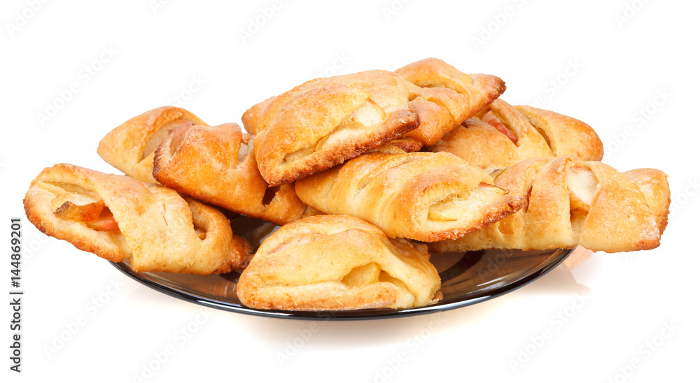 Buns with apple on a plate.