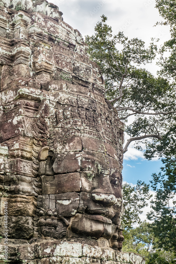 Giant face stone carving faces of Bayon temple in Angkor Thom, Siemreap, Cambodia