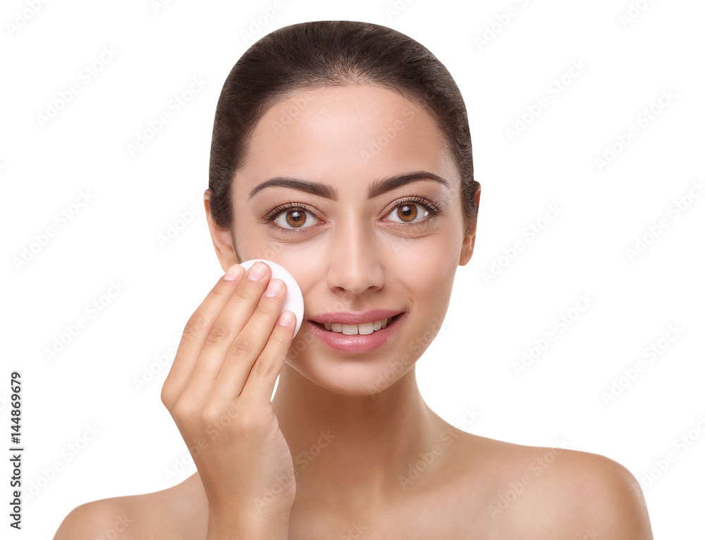 Beautiful indian girl with perfect skin, face cleaning Beautiful indian girl with perfect skin, face cleaning