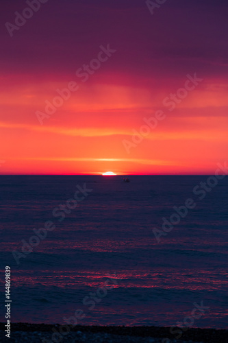 Natural Purple Color Sunset Or Sunrise Sky Over Sea After Storm 